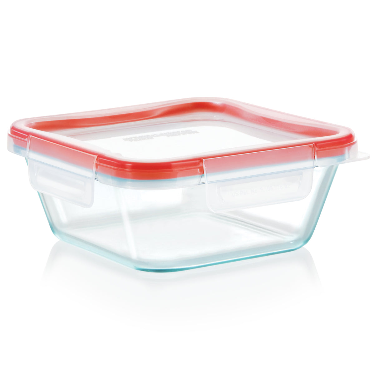 Clear glass food storage container with a red lid on a white background