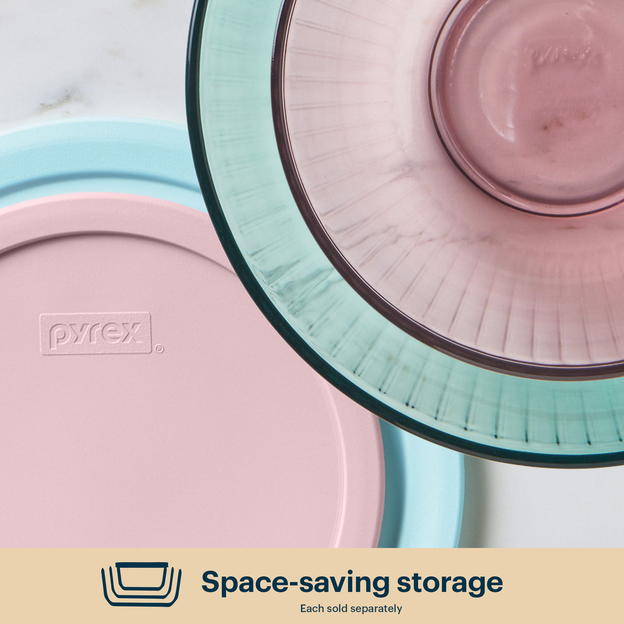 Pyrex storage containers with lids on a light background