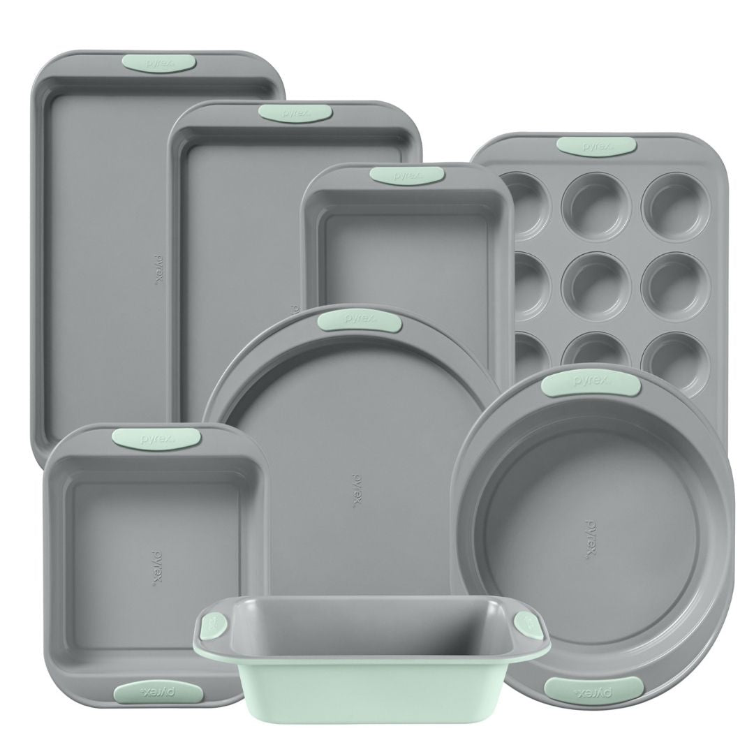 Set of gray silicone baking molds with green accents on a white background